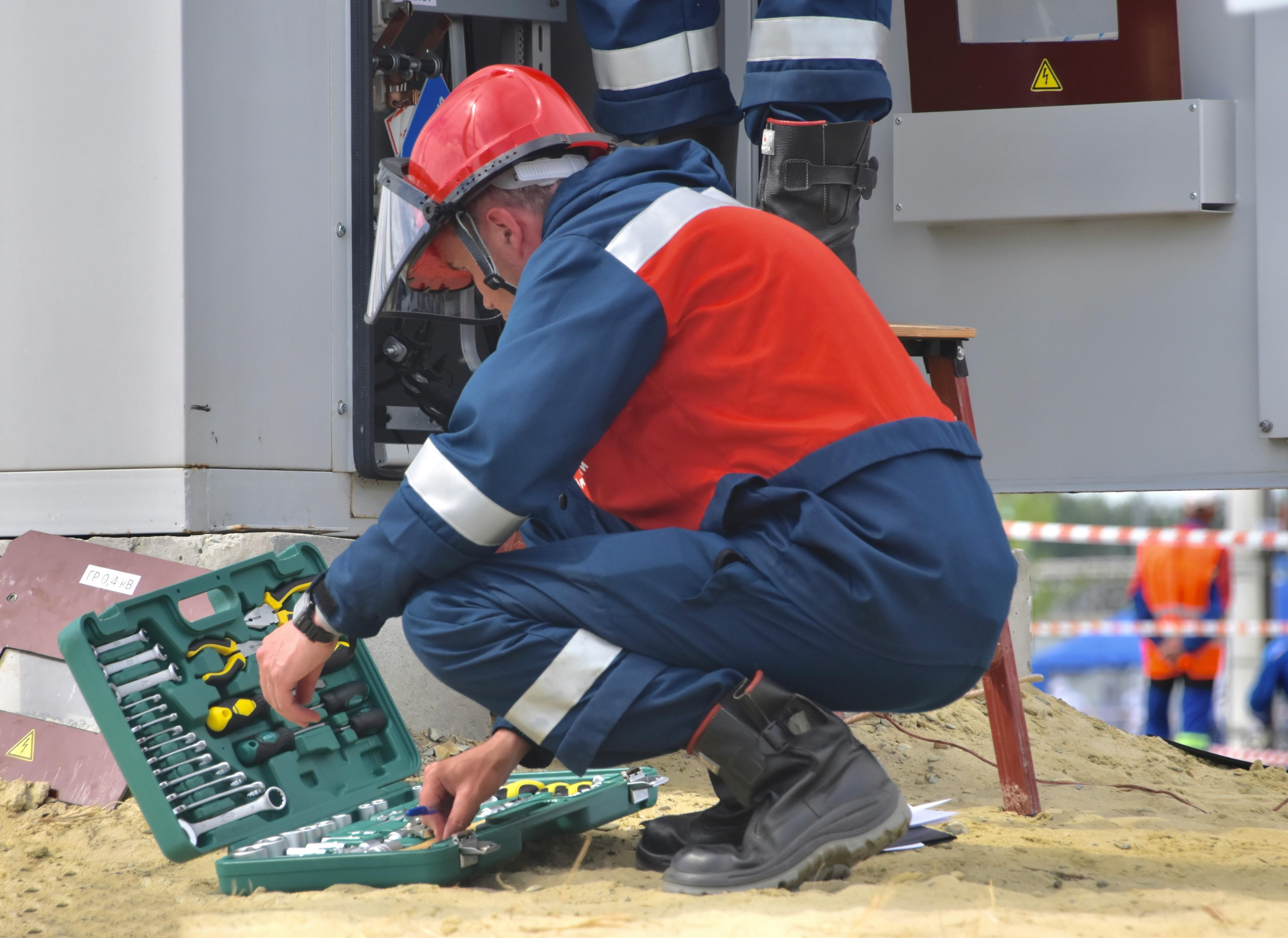 Licensed electrician working safely on an electrical installation